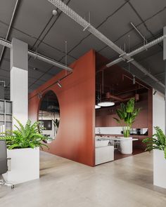 an office building with plants in the center and on the other side of the room