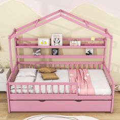 a child's bed with a pink frame and drawers underneath it, in a bedroom