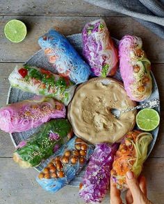 a plate filled with lots of different types of food on top of a wooden table