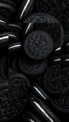 oreo cookies are stacked up together in black and white colors, as if they were chocolate