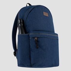 This Levi's backpack is signature style designed with everyday function in mind. It's made of durable denim containing sustainably sourced cotton and lined with lightweight poly to reinforce the integrity of the bag. The zippered main compartment is spacious enough to hold what you need for the day and the zippered back compartment is padded, and can be used to hold your laptop or tablet. Use the bottle pocket on the side to hold your beverage and the zippered pocket on the front to help secure Casual Backpack For Back To School, Casual Canvas Backpack With Zipper Pocket, Casual School Backpack With Water Bottle Pocket, Casual Denim Blue Backpack For Daily Use, Casual Backpack With Zipper Closure, Casual Backpack For Everyday Use, Casual Everyday Backpack, Denim Blue Backpack For Travel And Back To School, Denim Blue Backpack For Everyday And Back To School