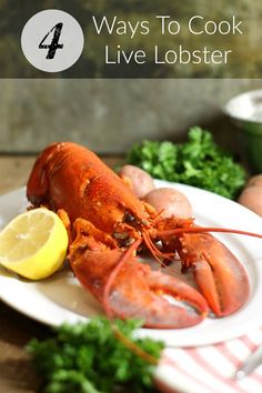 there is a lobster on the plate with lemon wedges and parsley next to it