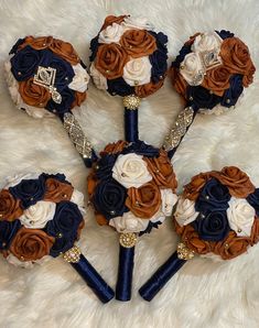 the bridal bouquets are made up of blue, brown and white flowers with gold accents