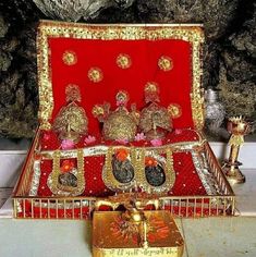 an elaborately decorated red and gold casket