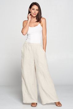 "- Palazzo Pants - Elastic waist - Relaxed comfortable pants - Wide leg full length - Side pockets - Comfortable breezy - Great for any occasion - 100% linen - Made in USA Size measurements Style was measured laid flat. Please multiply by two to get approximate circumference *Small waist : 14.5\" waist stretched : 19\" hip : 23\" rise : 14\" inseam : 27\" outseam : 39\" *Medium waist : 15.5\" waist stretched : 20\" hip : 24\" rise : 14.5\" inseam : 27.5\" outseam : 39.5\" *Large waist : 16.5\" w Linen Wide-leg Pants For Loungewear, Linen Wide-leg Harem Pants For Loungewear, Non-stretch Linen Wide Leg Pants For Loungewear, Beige Linen Full-length Bottoms, Linen Palazzo Pants, Stretch Linen Full-length Bottoms, Linen Harem Pants, Comfortable Pants, Pants With Pockets