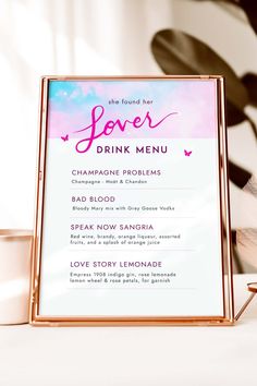 a pink and gold sign with the words love drink menu on it