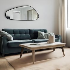 a living room with a couch, coffee table and mirror