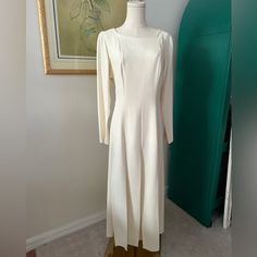 "This is such a cool piece. Minimalist with a flare. The bottom of the dress is made up of two layers of panels. Making for a flowy and unique design.  Size 10 16\" armpit to armpit 15\" waist 50\" long (roughly)" Elegant Full Length Cream Dress, Flowy Square Neck Midi Dress For Evening, Formal Flowy Dress With Square Neck, Long Sleeve Bias Cut Formal Dress, Formal Flowy Square Neck Dress, Flowy Square Neck Formal Dress, Formal Stretch Bias-cut Dresses, Cream Stretch Evening Dress, Formal Full Length Cream Dress