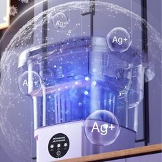 a close up of a machine in front of a glass window with the word ag + on it