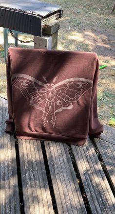 a brown hoodie with a bleached moth design on the back Bleach Moth Hoodie, Bleached Moth Shirt, Brown Bleached Shirt, Bleach Moth Shirt, Tshirts Design Ideas Creative, Moth Bleach Design, Bleach Painting Clothes Easy, Bleach Painted Sweatshirt