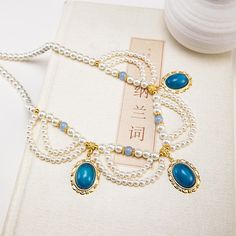 Material: Alloy Color: Multi-Layer Lotus, Small Lotus Fashion Element: Tassel, Chain Style: Antique Style Handmade Elegant Alloy Necklaces, Elegant Handmade Alloy Necklaces, Handmade Dangle Necklace In Alloy, Handmade Alloy Dangle Necklace, Handmade Dangle Alloy Necklace, Bohemian Pearl Necklaces With Adjustable Chain, Bohemian Pearl Necklace With Adjustable Chain, Elegant Blue Alloy Necklace, Ancient Necklace