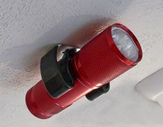 a red flashlight is hanging from the ceiling