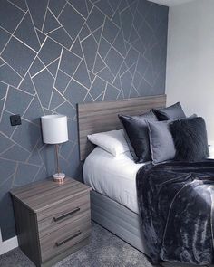 an instagramted photo of a bed and nightstands in a room with grey walls