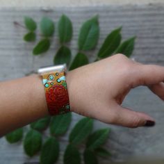 "Red Rose and Turquoise Apple Watch Band This is a personalized, made to order listing; please allow time for its creation. Just click the Shipping & Policies tab to view our current production turnaround time. Pick your color scheme (where applicable) and your new watch band will be made just for you! Stained in a saddle tan with hand painted red roses and turquoise accents. If your design requires a hand-stamped name or quote (which we love to add!) please leave that information in the not Leather Apple Watch Band, Turquoise Accents, New Watch, Apple Watch Bands Leather, Apple Watch Band, Red Rose, Apple Watch Bands, Watch Band, Hand Stamped