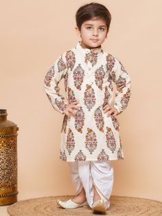 Put forword your son's look by choosing this AJ Design off white Dhoti Kurta for boys. Tailored with excellint quality cotton fabric, this fabric is bound to impress everyone around you. The dhoti kurta gives a rich and fantabulous look will appier after wearing this.The cotton fabric gives you a rich comfort and perfectly tailored by which it can easy fit according to your size. Made form cotton material, in this boys ethnic set comprises dhoti and kurta. You can team this dhoti kurta set with Transitional Off-white Cotton Set, White Sets With Traditional Drape For Transitional Seasons, White Long Sleeve Churidar For Puja, White Traditional Drape Kurta For Diwali, Fitted White Kurta With Traditional Patterns, White Fitted Kurta With Traditional Patterns, White Traditional Drape Sherwani For Puja, White Sherwani For Puja And Diwali, White Sherwani For Diwali Puja