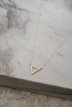 Tiny Gold Triangle Charm Necklace 9K 14K 18K Gold Necklace | Etsy Water Element Symbol, Jewelry Wishlist, Gold Triangle, Gold Water, Minimal Necklace, 18k Gold Necklace, Resin Jewellery, Triangle Pendant, Gold Bar Necklace