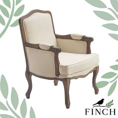 a white chair sitting in front of a green leafy background with the words finch furniture