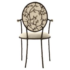 a white and black chair with branches on it's backrest, against a white background