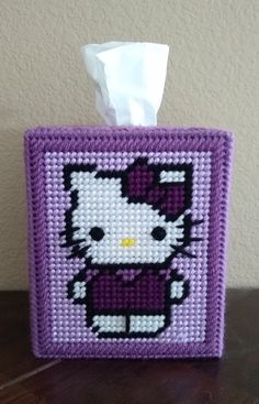 a hello kitty tissue dispenser on a table