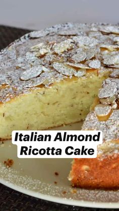 a close up of a cake on a plate with the words italian almond ricotta cake