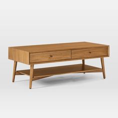 a wooden coffee table with two drawers on one side and an open drawer on the other