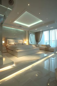 a large white bed sitting in the middle of a room