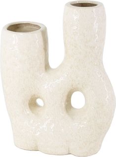 a white vase with two holes in it