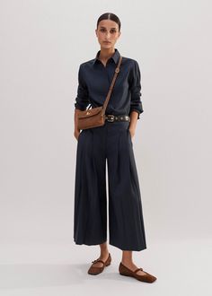 Elegant Wide Leg Pants With Accordion Pleats, Elegant Pleated Wide Leg Pants For Work, Elegant Workwear Bottoms With Folds, Elegant Folded Bottoms For Workwear, Elegant Pleated Bottoms With Wide Hem, Elegant Wide Leg Pants For Spring, Fitted Pleated Wide Leg Pants For Fall, Elegant Pleated Wide Leg Pants For Office, Chic Folded Bottoms For Fall