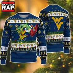 NCAA West Virginia Mountaineers Grinch Hand Ugly Christmas Sweater Get ready to show off your school spirit this holiday season with the NCAA West Virginia Mountaineers Grinch Hand Ugly Christmas Sweater. This fun and festive piece of apparel is perfect for fans looking to blend their love for college sports with the cheerful spirit of Christmas. Featuring a unique Grinch hand design prominently displayed against a backdrop that celebrates the West Virginia Mountaineers, this ugly Christmas swea Grinch Hands, Pittsburgh Panthers, 3d Sweater, Nfl Detroit Lions, Christmas Ugly Sweater, Christmas Grinch, West Virginia Mountaineer, Holiday Attire, Funny Xmas