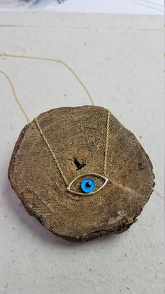 "Sterling Silver Evil Eye Necklace, Evil Eye Jewelry Beautiful and delicate evil eye necklace. Its perfect for wearing alone or layering with other necklaces. * Chain Size: Approx 18.5\" Inches * Pendant Size: Approx height .6\" in and width 1\" in * Cubic Zirconia: Clear * Available: Gold * Evil Eye Necklace Item no: 187000141 ♥ Come's with a gift pouch ready for giving. for one special lady! Please allow up to 1-3 business days for this item to ship. Multiple items are shipped with each Gift B Metal Evil Eye Necklace With Round Shape, Evil Eye Metal Necklace With Round Shape, Evil Eye Round Metal Necklace, Evil Eye Metal Jewelry For Gifts, Metal Evil Eye Jewelry For Gift, Evil Eye Metal Jewelry Gift, Spiritual Gold Eye-shaped Necklace, Adjustable Sterling Silver Evil Eye Necklace, Minimalist Evil Eye Pendant Necklace