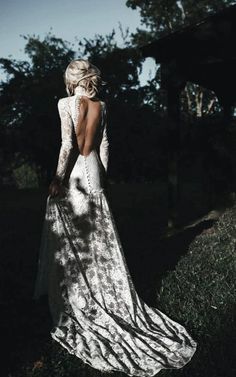 the back of a woman in a white dress