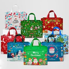 christmas shopping bags are lined up against a white background