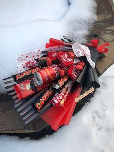 a pile of candy on top of snow covered ground