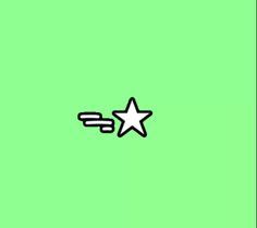 a black and white star is flying in the air on a green background with an arrow