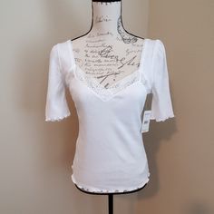 A Casual Cotton-Blend Tee Gets Girly With Lacy Details And The Sweetest Of Necklines, Balanced With A Back-Baring Scoop To Embellish Your Exit. Size Small) Sweetheart Neck Short Sleeves Scoop Back 60% Cotton, 40% Polyester Machine Wash, Dry Flat *All Items Sold From My Closet Are Video Taped Prior To Shipment To Show Quality And Cleanliness.* Fitted Lace Top T-shirt For Spring, White Stretch Top With Lace Trim, White Stretch Tops With Lace Trim, Feminine Fitted Tops With Lace Trim, Feminine Fitted Short Sleeve Tops, Feminine Fitted Short Sleeve T-shirt, Fitted White Short Sleeve Top For Spring, Fitted Feminine Short Sleeve Tops, Trendy White Lace Top