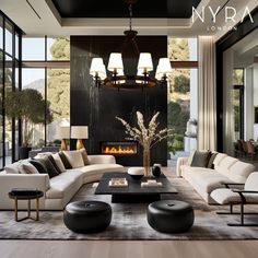 a living room filled with furniture and a fire place in the middle of an open floor plan