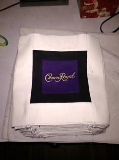 the cloth is folded up and ready to be sewn together with it's logo