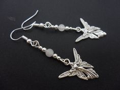 A pair of cute little hand made tibetan silver & opaque white jade bead  dangly fairy angel  themed Silver Jewellery Aesthetic Earrings, Handmade Silver Fairycore Jewelry, Adjustable Silver Fairycore Jewelry, Handmade Adjustable Fairy Jewelry, Handmade Fairy Style Dangle Jewelry, Whimsical Handmade Silver Earrings, Sterling Silver Fairycore Jewelry, Fairy Style Jewelry With Matching Earrings Gift, Handmade Fairy Dangle Jewelry