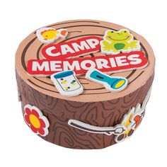 a wooden box that has some stickers on it and the words camp memories written in red