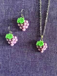 (11,707) Grapes Necklace or Earrings  Made from polymer clay, 7/8" x 5/8" Earrings on stainless steel ear wires  Necklace on 18" stainless steel chain  Much prettier in person. Nickel-free Polymer Clay Dangle Jewelry, Purple Dangle Polymer Clay Jewelry, Nickel-free Pink Polymer Clay Jewelry, Hypoallergenic Dangle Polymer Clay Jewelry, Cute Purple Resin Jewelry, Jewellery Sets, Wire Necklace, Clay Necklace, Steel Chain