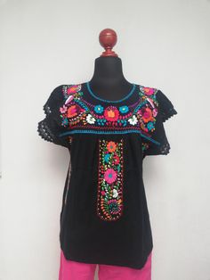 Beautiful Mexican blouse with floral style hand embroidery and lace details on the cuff. Mexican textile art has centuries of history and creativity throughout the country. Mexico is recognized as one of the leading countries with a beautiful artistic production in the textile world, miraculous hands of talented artisans from different states of the country create stunning embroidery clothing, and various items. #Oaxaca #Chiapas We ship anywhere in the word, from Tepic, Nayarit, mx. Made by arti Traditional Blouse With Floral Embroidery For Fiesta, Multicolor Folk Blouse With Embroidered Sleeves, Fiesta Multicolor Embroidered Blouse, Summer Fiesta Floral Embroidered Blouse, Traditional Embroidered Fiesta Blouse, Embroidery Clothing, Blanket Fabric, Mexican Textiles, Mexican Blouse