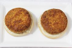 two small sandwiches on a white plate