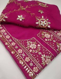 Item Overview ATHARVA Hand Embroidery Salwar Kameez/Majent Pink Chanderi Silk/Gota Pati Chiffon Dupatta/Custom Stitch Unstitch/Custom Anarkali/Gift Dno. CH1727 Fabric: * Shirt - Chanderi Silk- Hand Embroidered Neck 2.5 Mts - Beautiful Hand Embroidery * Dupatta: Chiffon Chinnon Dupatta/ All over Gota Patti Embroidery - 2.5 Mts- Latkans Tassels * Bottom Santoon Silk 2.5 Mts. (Doesn't require lining in stitching) Excusive Hand Embroidered Party Wear Punjabi Suit. Customization: * Fabrics Customizat Pink Georgette Churidar With Cutdana, Pink Cutdana Georgette Churidar, Pink Georgette Salwar Kameez With Cutdana, Semi-stitched Georgette Salwar Kameez With Dori Work, Festive Georgette Churidar With Cutdana, Anarkali Churidar With Dori Work In Georgette, Designer Georgette Salwar Kameez With Cutdana, Festival Anarkali Set With Dori Work In Georgette, Festival Georgette Anarkali Set With Dori Work