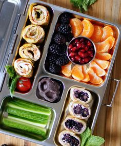 an assortment of fruits and vegetables in a tray