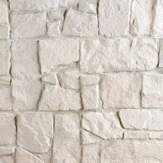 a white brick wall that has been made out of cement blocks and is being used as a background