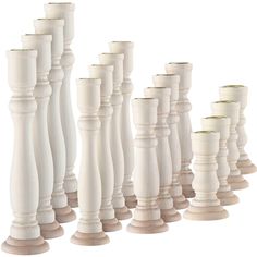 a row of white vases sitting next to each other