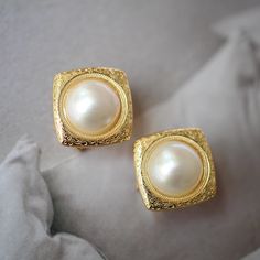 These stunning gold plated silver earrings feature a beautiful pair of hemisphere mabe pearl stones. With their intricate details and rich color, these push back studs are the perfect statement piece for any outfit. Handcrafted with care, these earrings are a true work of art and are sure to draw attention wherever you go. Whether you're looking for a unique gift or simply want to treat yourself. With their durable construction and timeless design, they're sure to become a beloved addition to yo Classic Gold Round Pearl Earrings, Classic Gold Pearl Earrings, Classic Yellow Gold Clip-on Pearl Earrings, Elegant Formal Clip-on Earrings, Fine Jewelry Gold Clip-on Pearl Earrings, Gold Clip-on Pearl Earrings Fine Jewelry, Anniversary White Gold Clip-on Earrings, Elegant Drop Clip-on Earrings As Gift, Gold Elegant Design Drop Clip-on Earrings