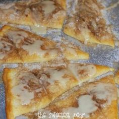 some food that is sitting on top of a pan with powdered sugar over it