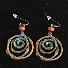 Nwot 1 1/2” Long Copper Swirls Dangling Fishhook Earrings With A Patina And They Have A Brick Red Bead. Rust Colored Copper Dangle Jewelry, Red Spiral Jewelry As Gift, Artsy Red Jewelry With Ear Wire, Spiral Shaped Red Jewelry For Gifts, Red Spiral Jewelry For Gifts, Bohemian Copper Dangle Jewelry, Artsy Red Nickel-free Jewelry, Artsy Red Dangle Jewelry, Red Artsy Drop Earrings