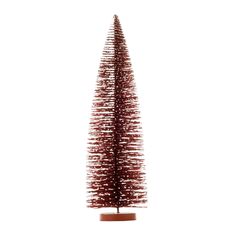 a small red christmas tree sitting on top of a wooden stand